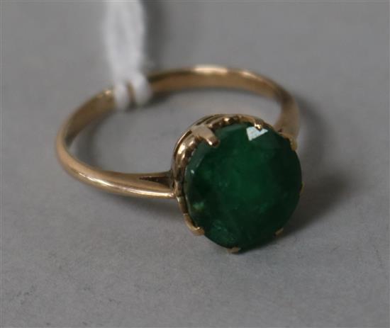 A yellow metal and emerald ring, size J.